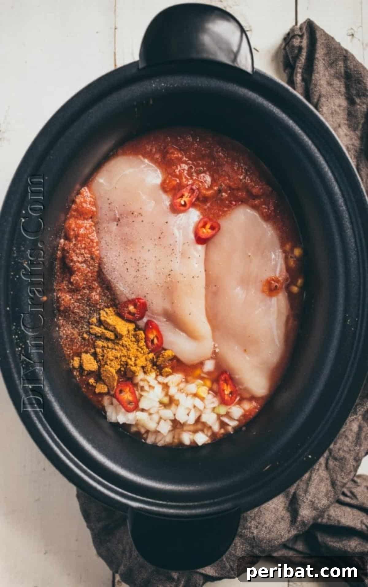 Preparing the slow cooker for chicken enchilada soup
