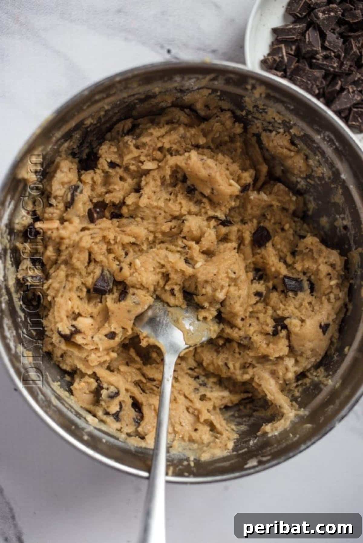 Irresistible Crock Pot Peanut Butter Chocolate Chip Bars 5 Adding the peanut butter chocolate chip dough to slow cooker