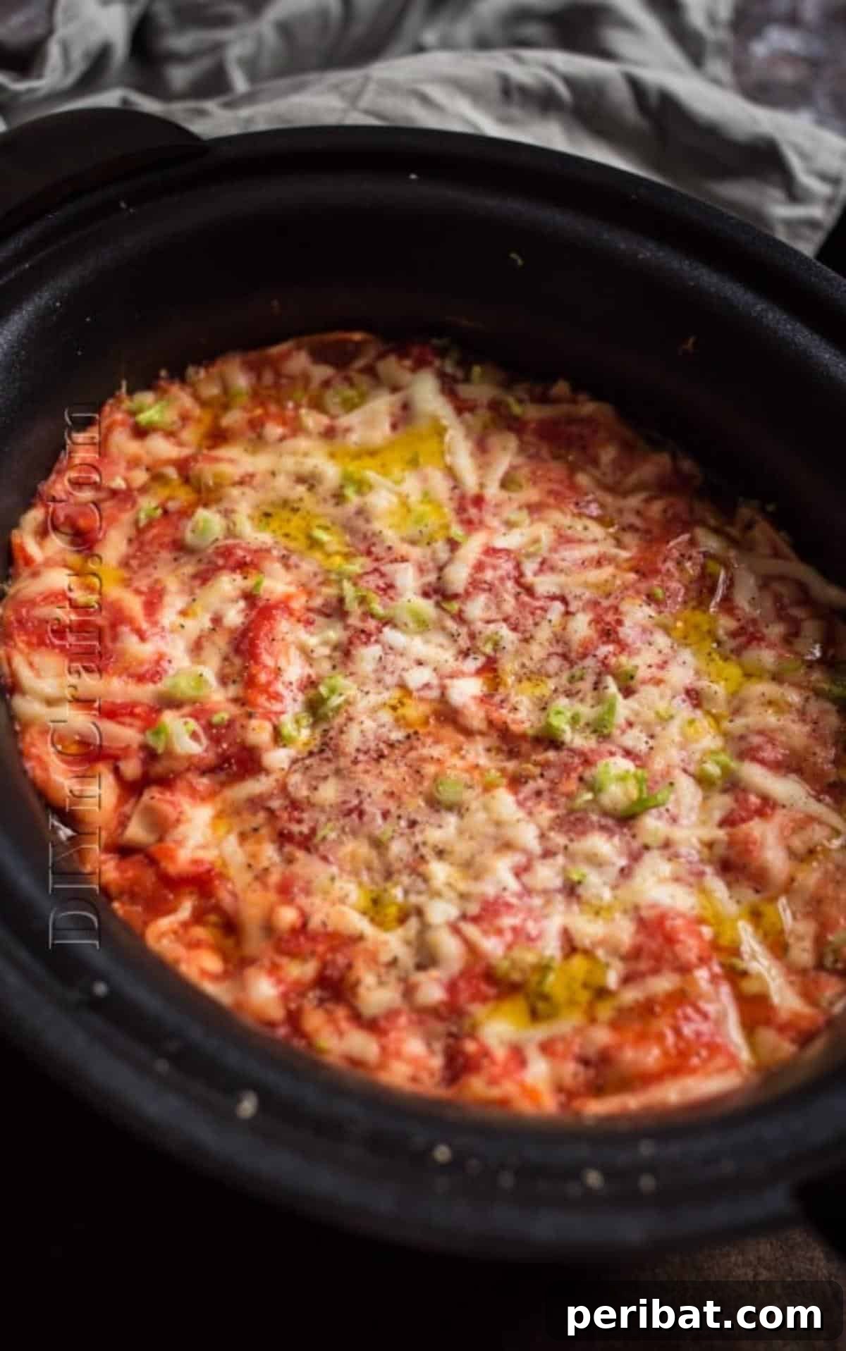 Slow Cooker Lasagna: Classic Flavor, Zero Fuss 6 Close-up of finished, bubbling slow cooker lasagna with melted cheese.