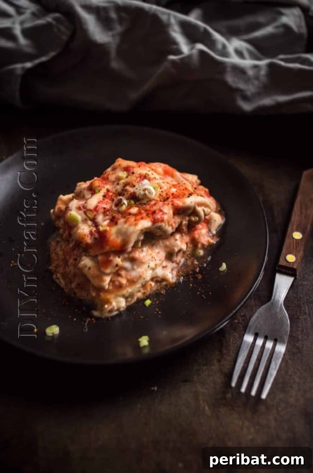 Slow Cooker Lasagna: Classic Flavor, Zero Fuss 8 A serving of slow cooker lasagna beautifully plated.