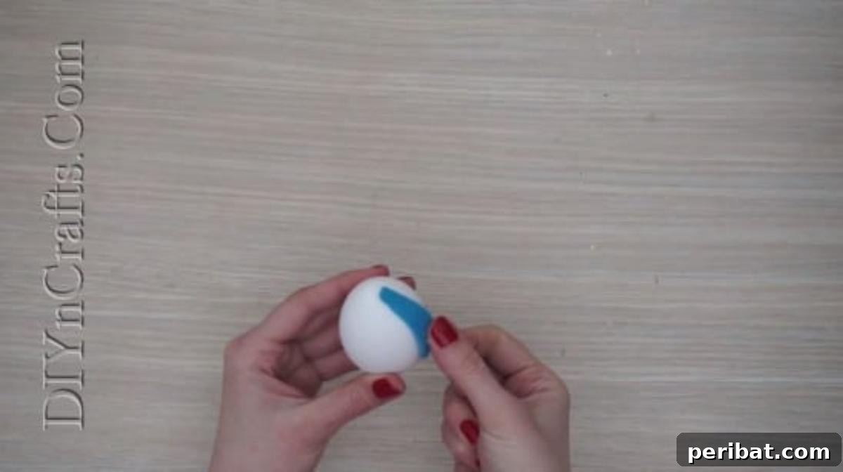 5 Brilliant & Easy Easter Egg Projects 12 Step 2 (continued): Both felt bunny ears securely hot-glued to the egg, creating the distinct and adorable silhouette of an Easter bunny.