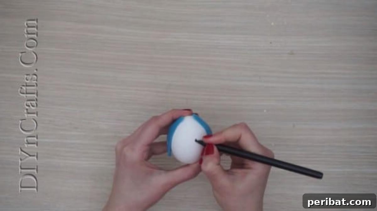 5 Brilliant & Easy Easter Egg Projects 13 Step 3: Using a fine-tipped pen to draw expressive facial features – eyes, nose, and mouth – onto the egg, completing the bunny's adorable face.