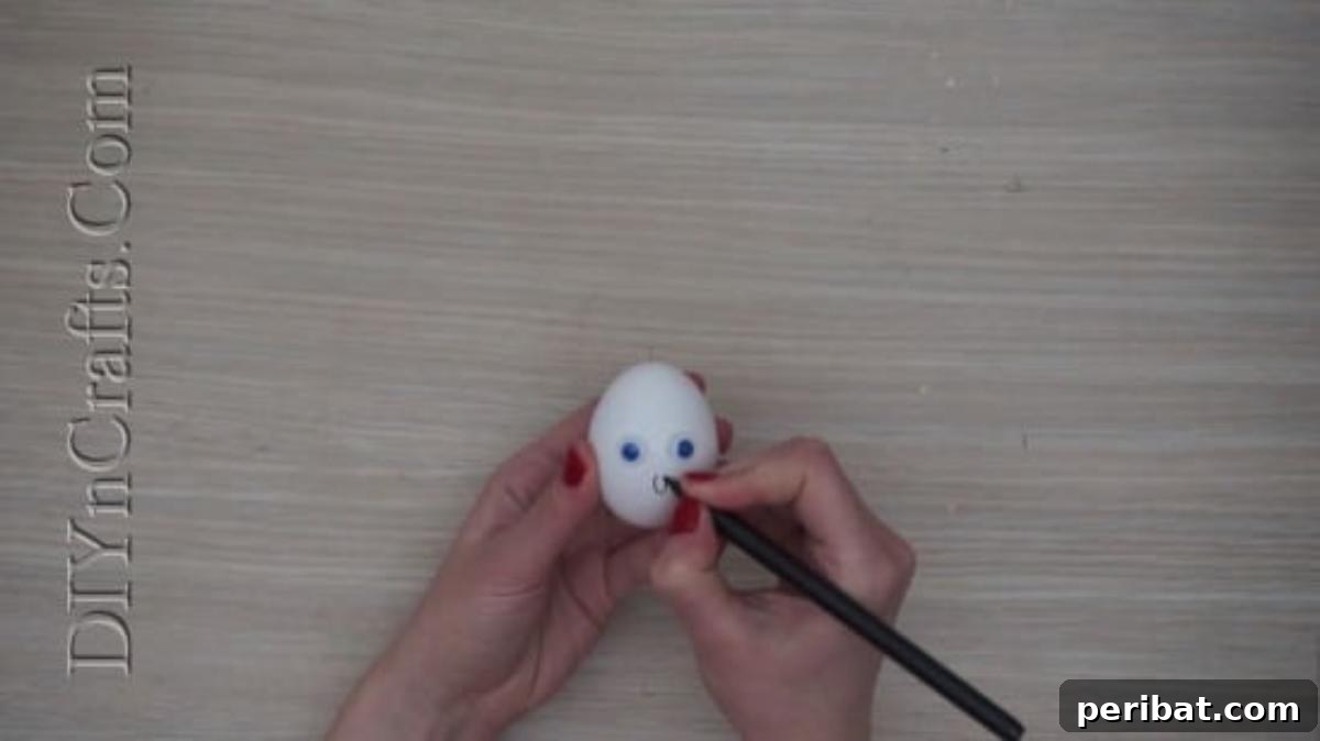 5 Brilliant & Easy Easter Egg Projects 22 Step 2: Using a pen to draw a wide, O-shaped mouth on the egg, completing its comical and unmistakably surprised facial expression.
