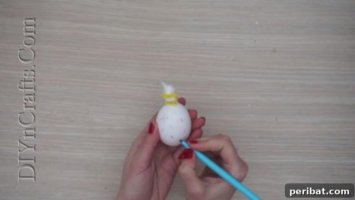 5 Brilliant & Easy Easter Egg Projects 5 Step 3 (continued): Close-up of an egg adorned with drawn sprinkles and a pipe cleaner 'drizzle', creating an irresistible ice cream topping.