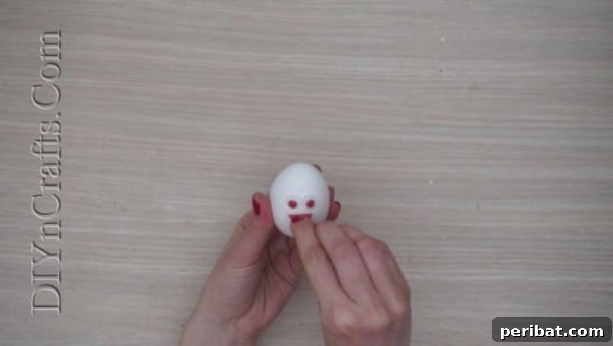 5 Brilliant & Easy Easter Egg Projects 8 Step 1 (continued): Close-up view of an egg with googly eyes and a beak, showcasing the emerging personality of the bird's face.