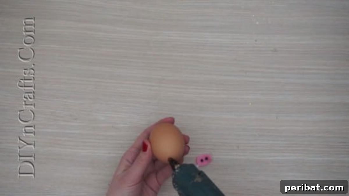 5 Delightful & Simple Easter Egg Crafts 12 Cutting out felt shapes (ears, snout, tail) for the pig egg craft.