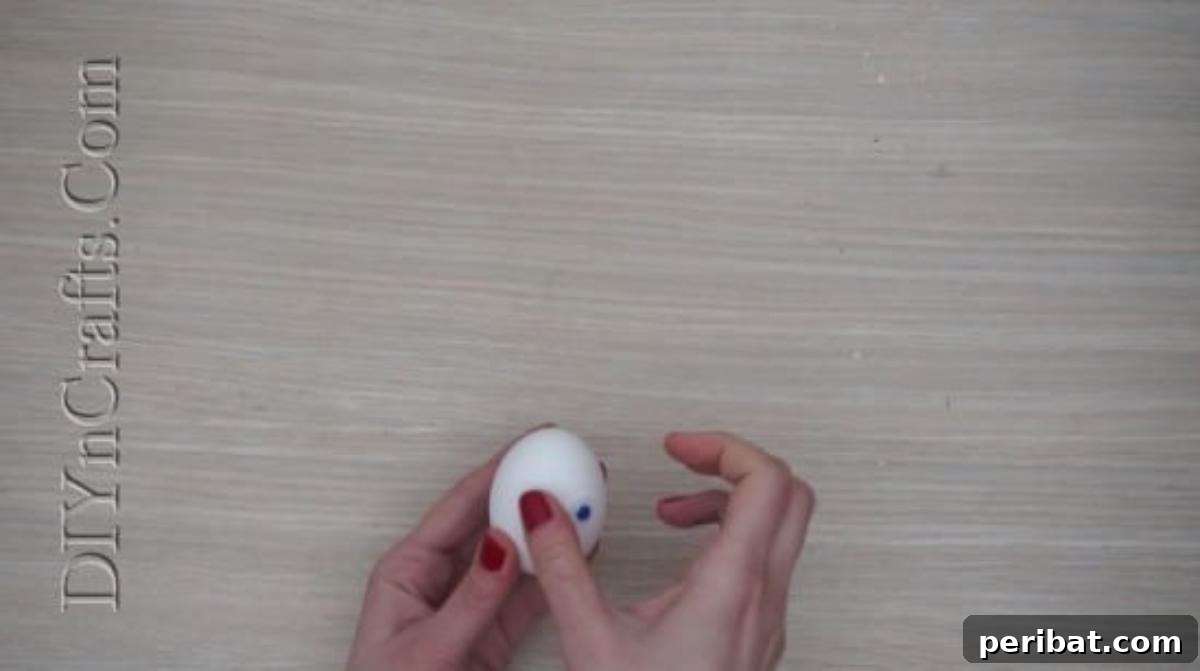 5 Delightful & Simple Easter Egg Crafts 18 Two googly eyes now securely glued onto the Easter egg, forming the bunny's eyes.