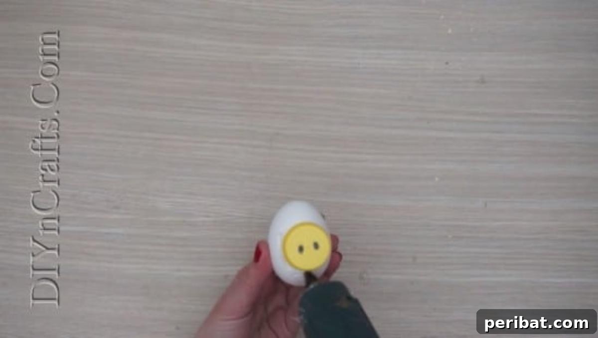 5 Delightful & Simple Easter Egg Crafts 25 Drawing eyes inside the bottle cap and a mouth below it on the Easter egg to create the snorkeling egg's face.