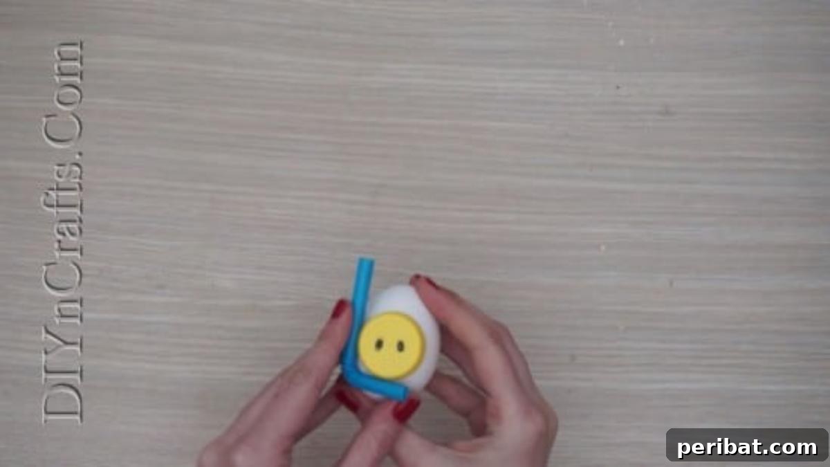 5 Delightful & Simple Easter Egg Crafts 26 Cutting a bendy straw and attaching it with hot glue to the side of the Easter egg to form the snorkel.
