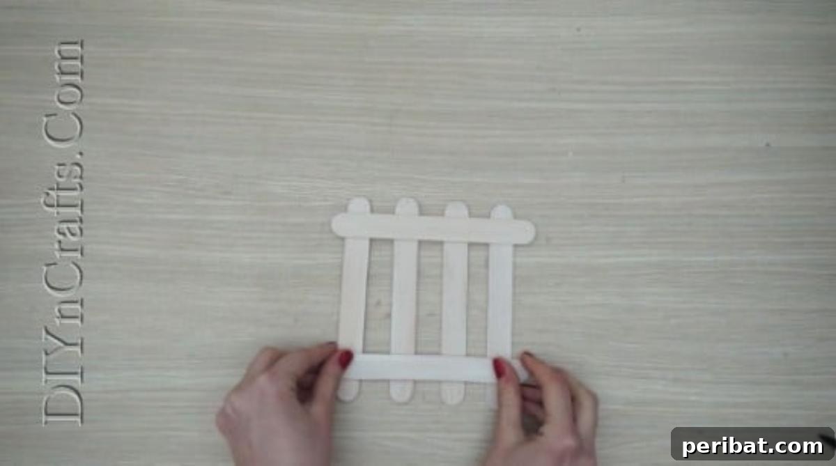 Craft Stick Easter Magic: 5 Simple DIY Projects 12 The assembled craft stick fence structure before embellishments
