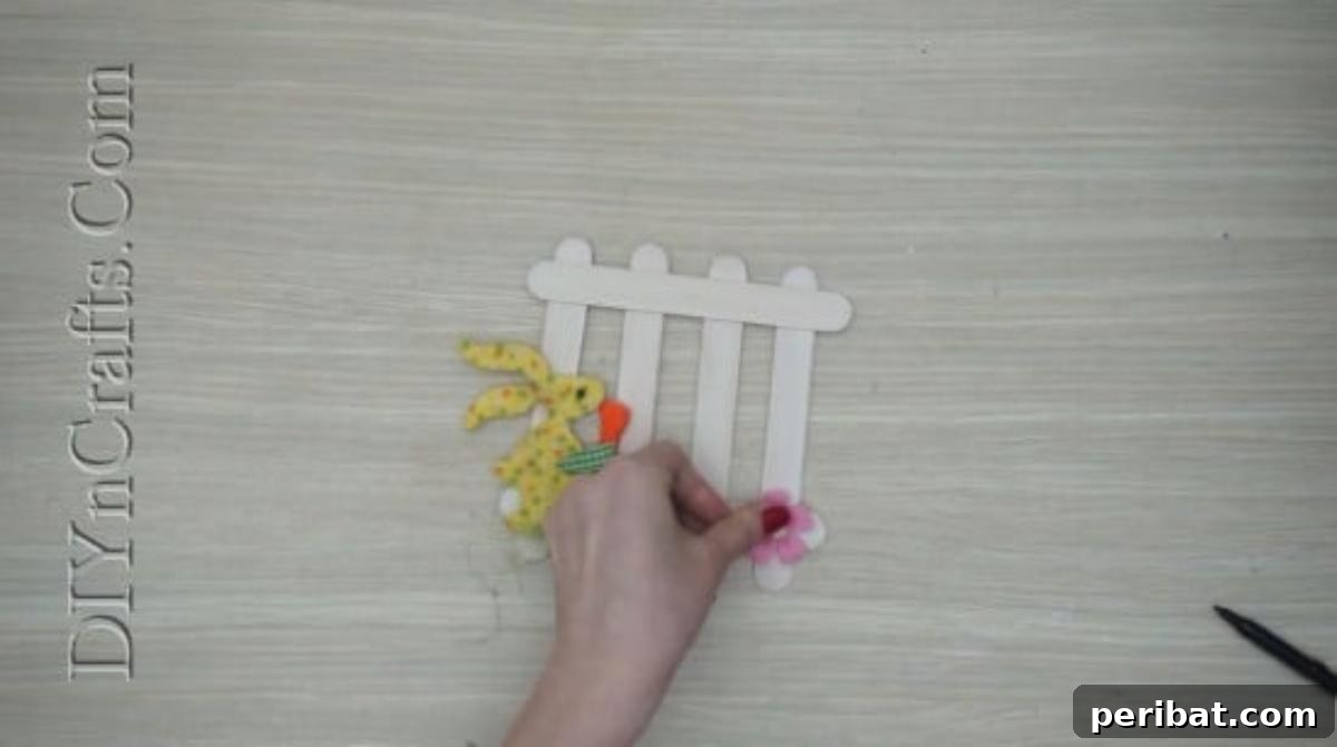 Craft Stick Easter Magic: 5 Simple DIY Projects 14 Adding small heart embellishments to the Easter craft stick fence