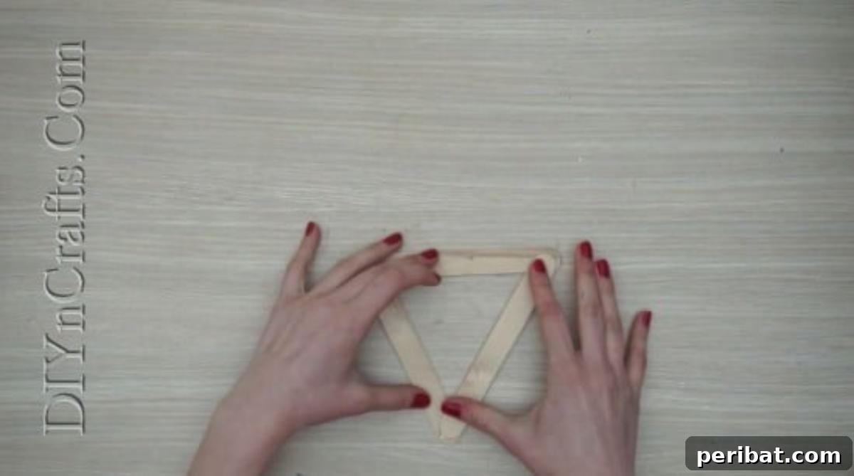 Craft Stick Easter Magic: 5 Simple DIY Projects 3 Triangle base formed from three craft sticks for an Easter bunny