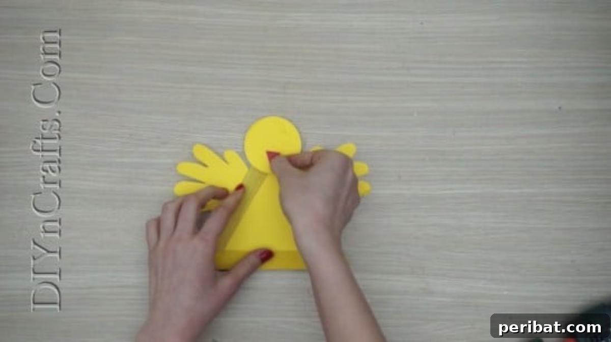Craft Stick Easter Magic: 5 Simple DIY Projects 28 Orange construction paper triangle glued as the chick's beak