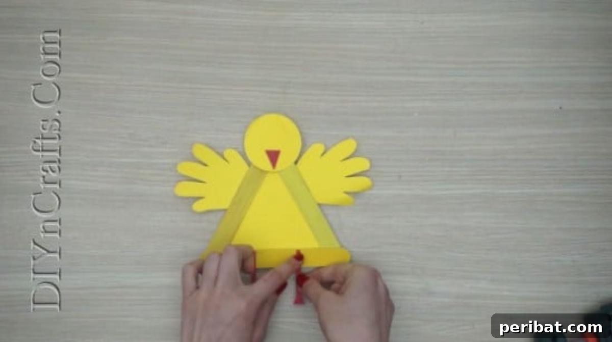 Craft Stick Easter Magic: 5 Simple DIY Projects 29 Red construction paper legs glued to the bottom of the chick's body