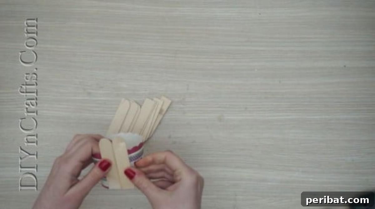 Craft Stick Easter Magic: 5 Simple DIY Projects 32 Several craft sticks glued around the cup, forming the basket's sides