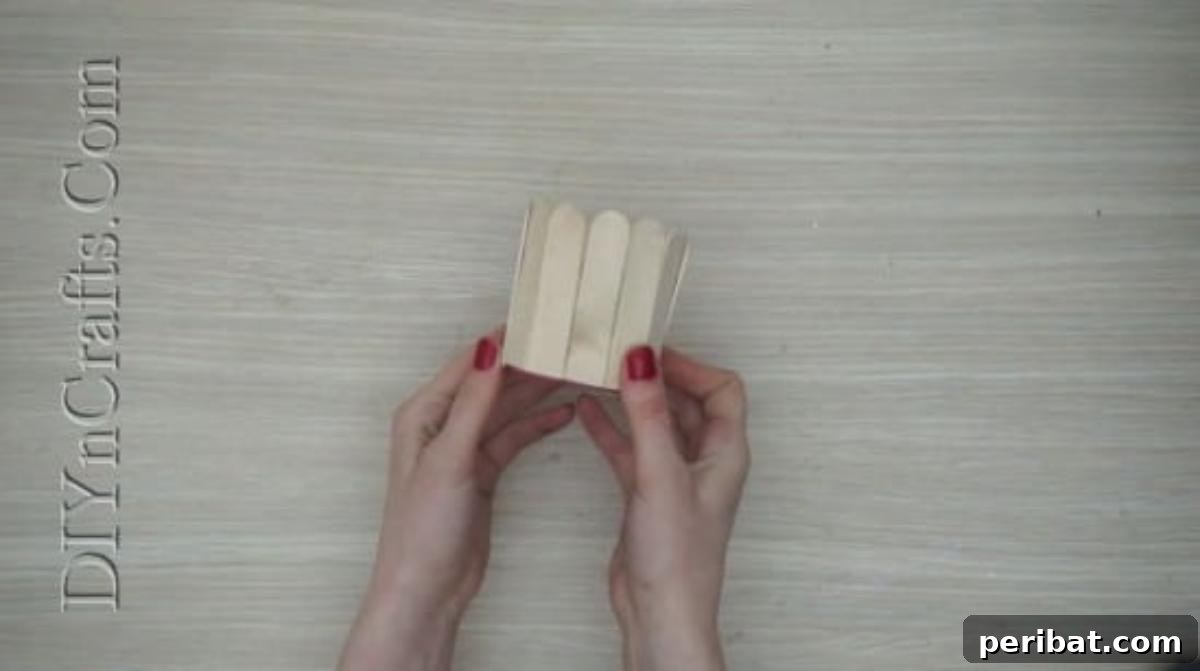 Craft Stick Easter Magic: 5 Simple DIY Projects 33 All craft sticks glued around the cup, forming the main basket structure