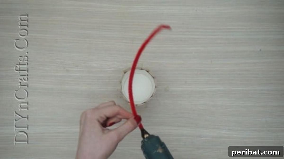 Craft Stick Easter Magic: 5 Simple DIY Projects 34 Hot gluing one end of a bent pipe cleaner onto the craft stick basket as a handle