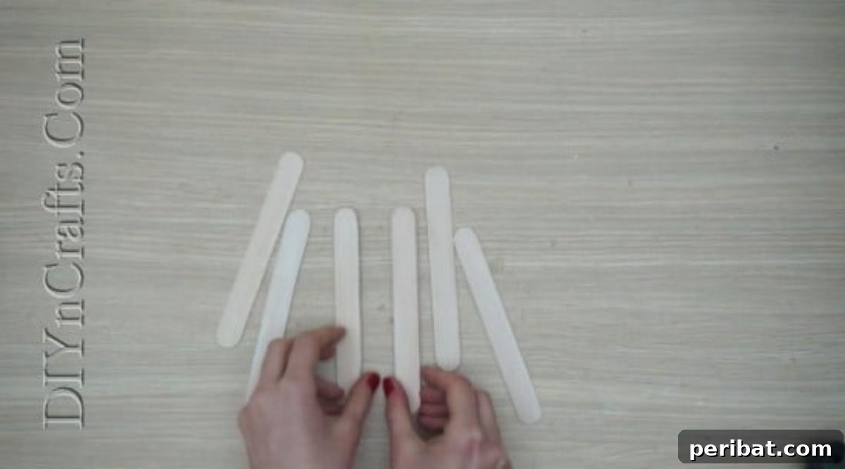 Craft Stick Easter Magic: 5 Simple DIY Projects 9 Six craft sticks painted white and drying for the Easter fence