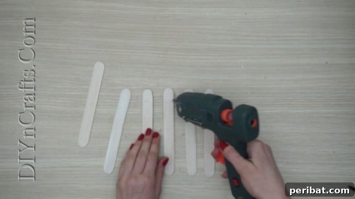 Craft Stick Easter Magic: 5 Simple DIY Projects 10 Arranging four white craft sticks for the vertical fence pickets