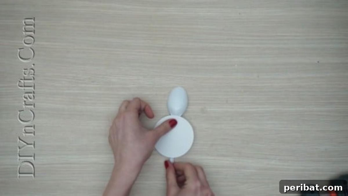 Spoonfuls of Fun 5 Easter Crafts for Kids Using Plastic Spoons 20 The white paper circle is now firmly attached to the plastic spoon, creating a round body for the bunny craft.