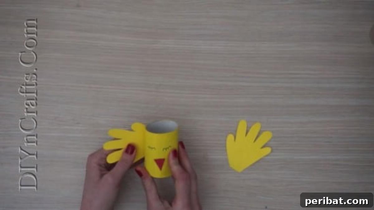 Instant Easter Fun: 5 Crafts for Kids in Under 5 Minutes 12 Gluing yellow construction paper wings onto the sides of the chick's body.