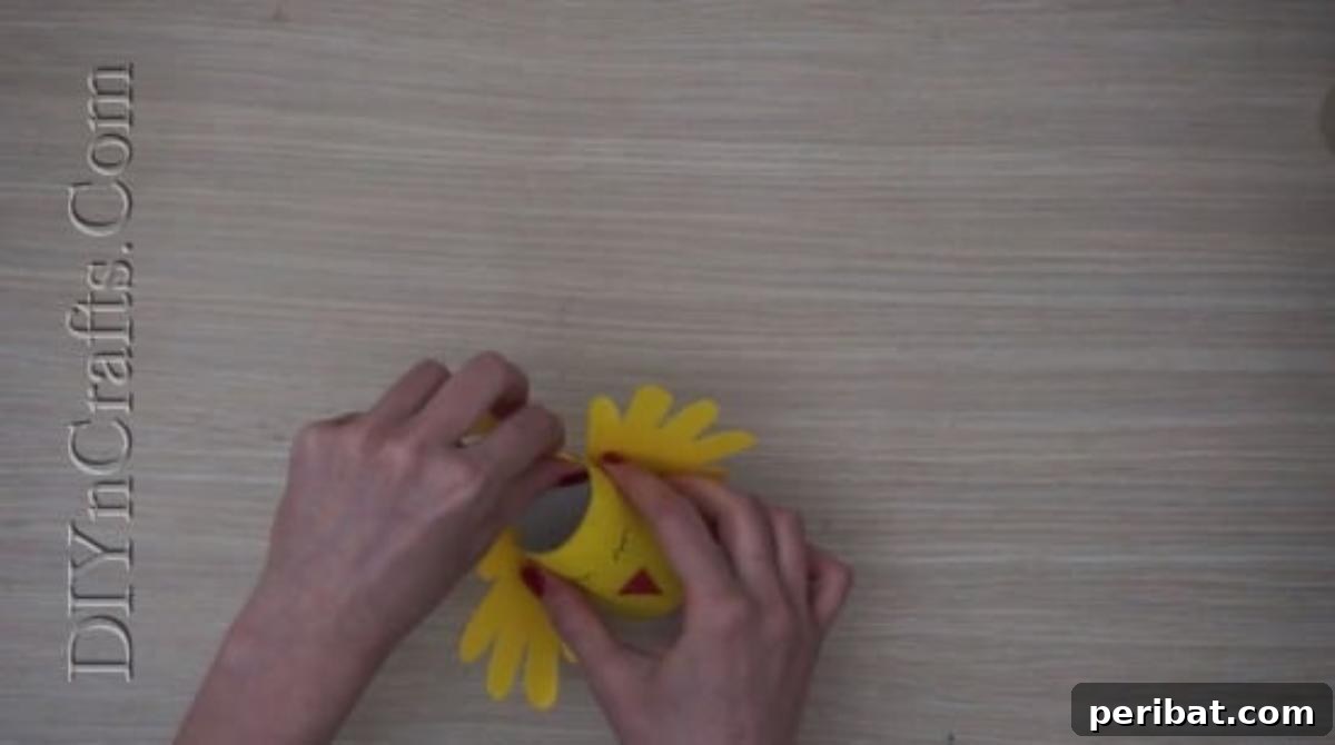 Instant Easter Fun: 5 Crafts for Kids in Under 5 Minutes 13 Attaching a yellow construction paper strip to form a handle for the Easter chick basket.