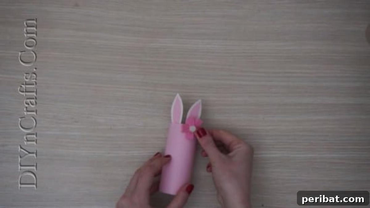 Instant Easter Fun: 5 Crafts for Kids in Under 5 Minutes 17 Adding a small flower embellishment near the ear of the bunny pencil cup for decoration.