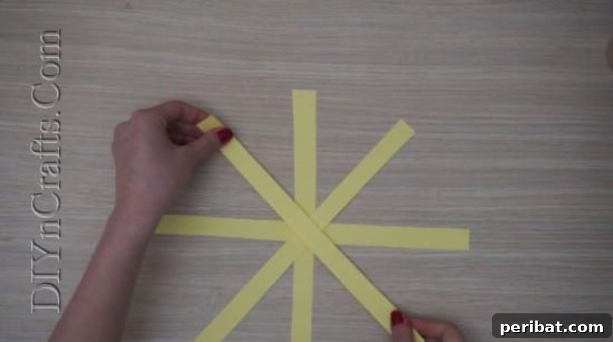 Instant Easter Fun: 5 Crafts for Kids in Under 5 Minutes 22 Adding the remaining two paper strips at 45-degree angles to the center, creating an eight-pointed star shape.