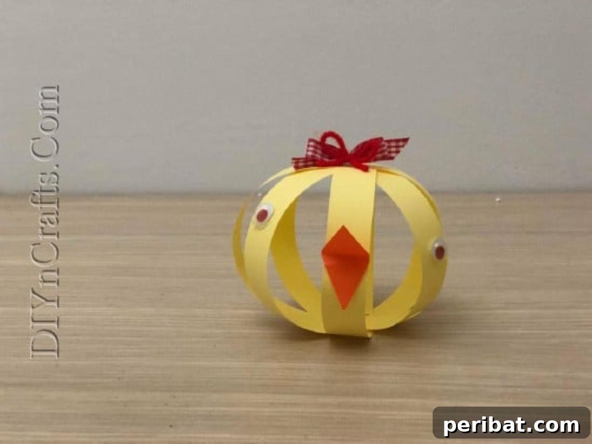 Instant Easter Fun: 5 Crafts for Kids in Under 5 Minutes 27 The completed spherical paper strip chick, ready for display.