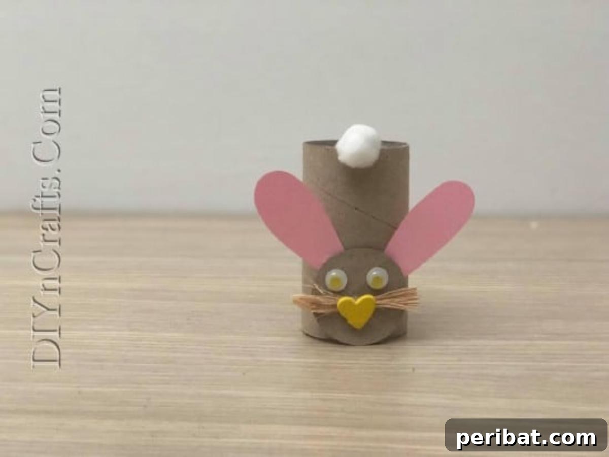 Instant Easter Fun: 5 Crafts for Kids in Under 5 Minutes 33 The finished paper roll bunny, standing tall with its fluffy tail and cute face.