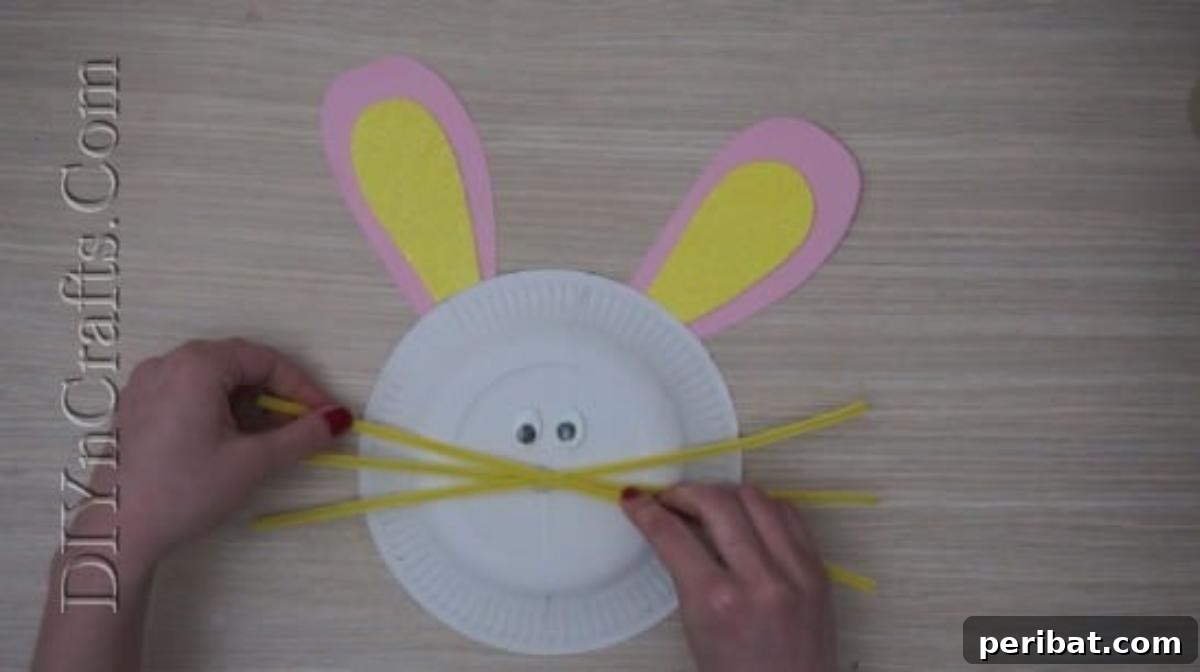 Instant Easter Fun: 5 Crafts for Kids in Under 5 Minutes 7 Using pipe cleaners to create charming whiskers on the paper plate bunny.