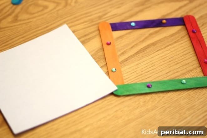 Crafting Summer Memories: Delightful Popsicle Stick Projects for Kids 11 Decorated Popsicle Stick Picture Frames displaying photos