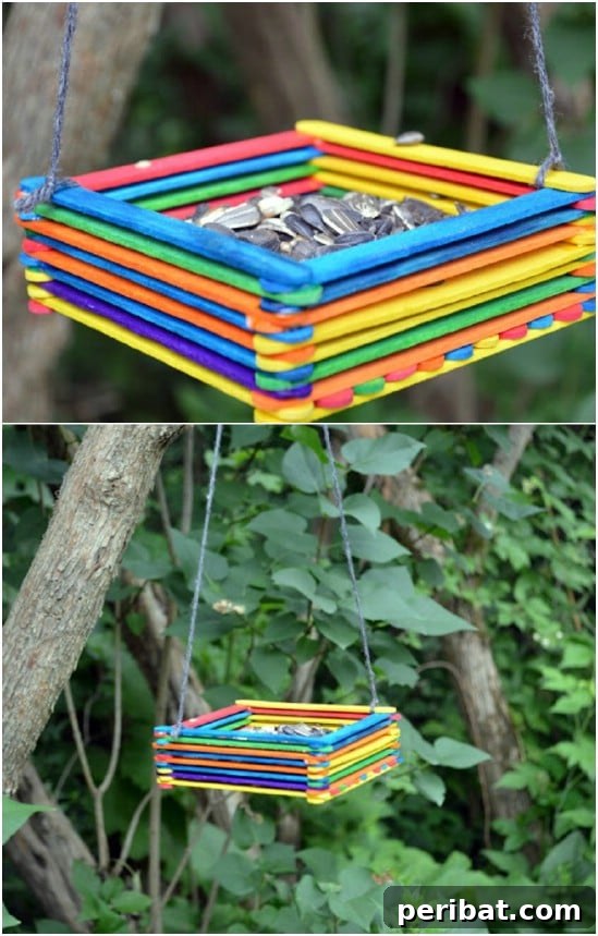 Crafting Summer Memories: Delightful Popsicle Stick Projects for Kids 13 Easy DIY Popsicle Stick Bird Feeder hanging from a branch