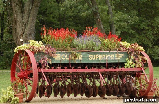 Rustic Charm: 10 Creative Farm Equipment Upcycles for Home & Garden Decor 6 Garden decor featuring an upcycled old farm plow holding potted plants and flowers