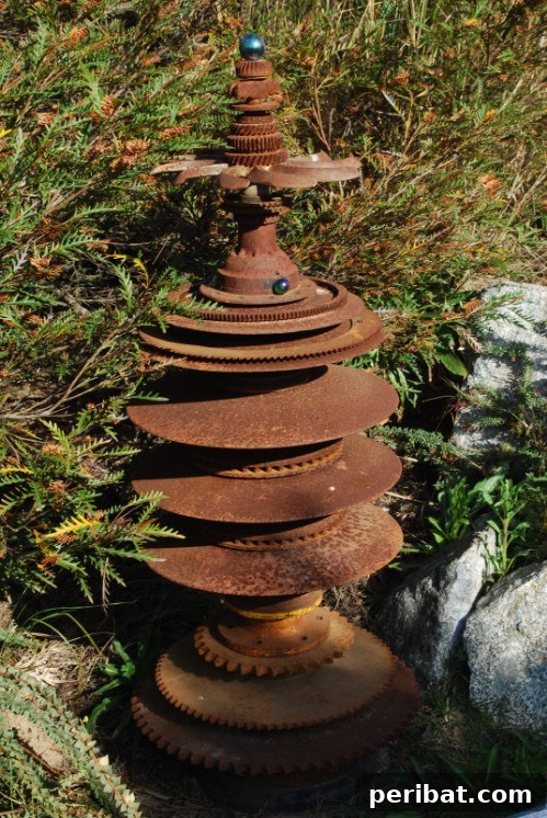 Weathered Wonders: 11 DIY Metal Accents for Your Garden 10 Rusty Metal Disc Tree