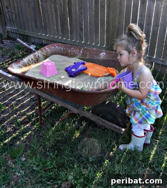Easy Repurposed Wheelbarrow Sandbox