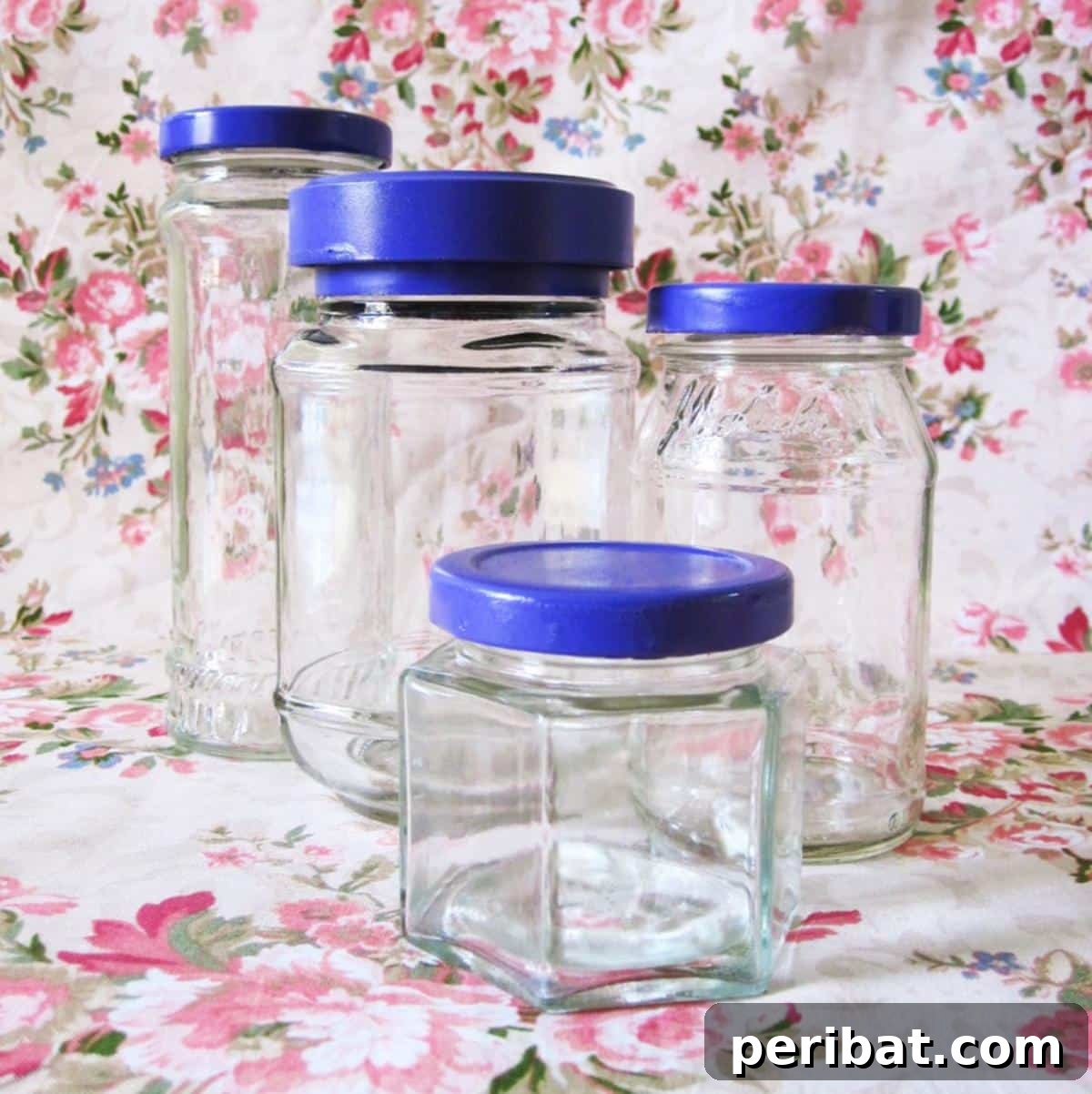 A set of matching kitchen canisters made from repurposed glass jars with uniformly painted lids.