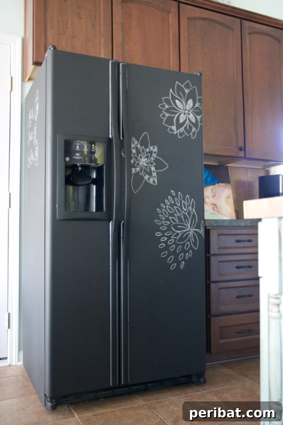 A black refrigerator surface completely painted with chalkboard paint, ready for messages and drawings.