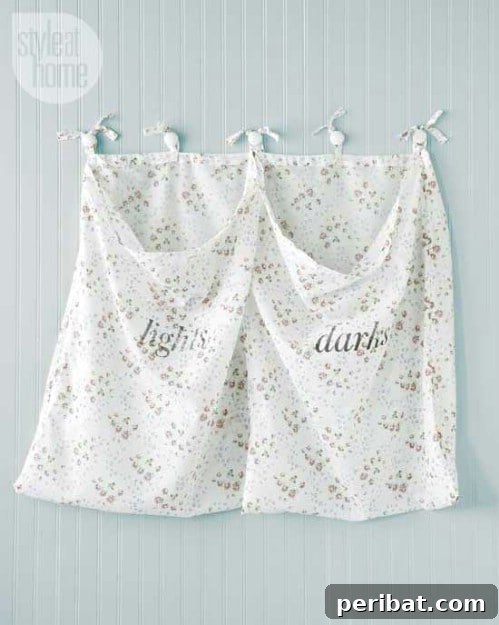 Ingenious DIY Laundry Storage for Effortless Organization 15 Repurposed Drapery Wall-Mounted Laundry Hamper with two sections