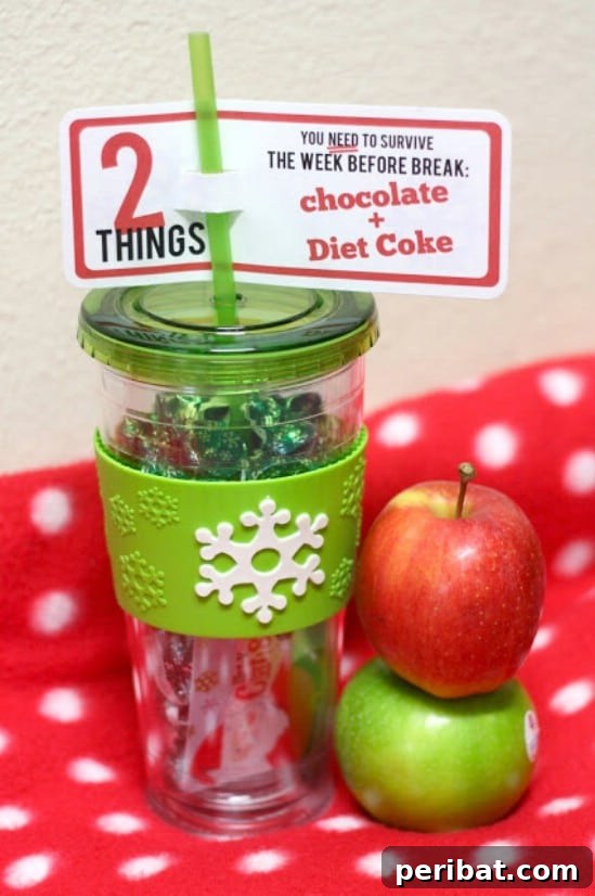 The Essential 50 Plus Creative Christmas Printables Pack 49 Teacher’s Gift Printable, including a tag for a custom cup and candy gift.