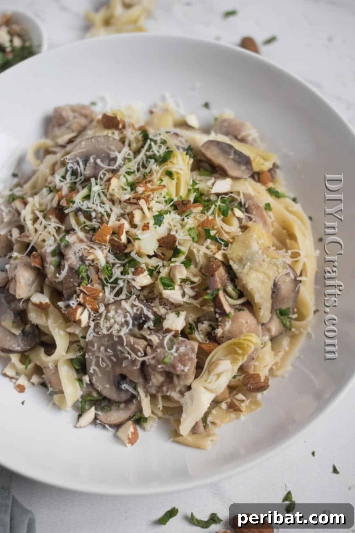 The Ultimate Family Favorite Chicken Pasta 6 A close-up of delicious chicken pasta served on a plate, garnished with herbs