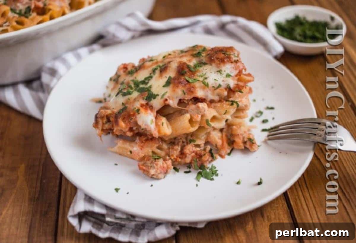 Served baked ziti on a plate with fresh parsley