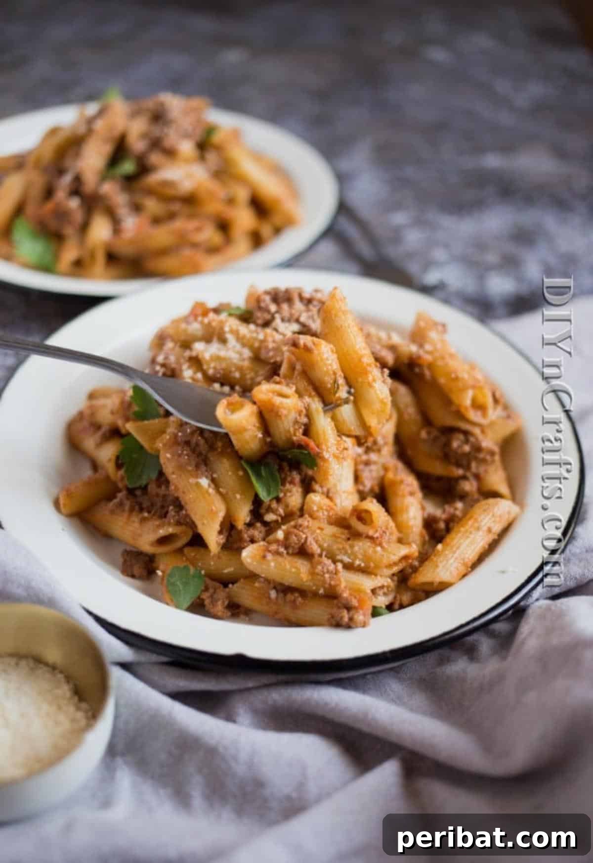 Close-up of hearty slow-cooker bolognese sauce with fresh basil