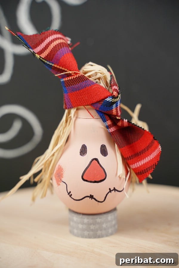 Whimsical Scarecrow Creations for Festive Autumn Decor 3 Charming lightbulb scarecrow with a flannel hat and raffia hair, perfect for fall tablescapes