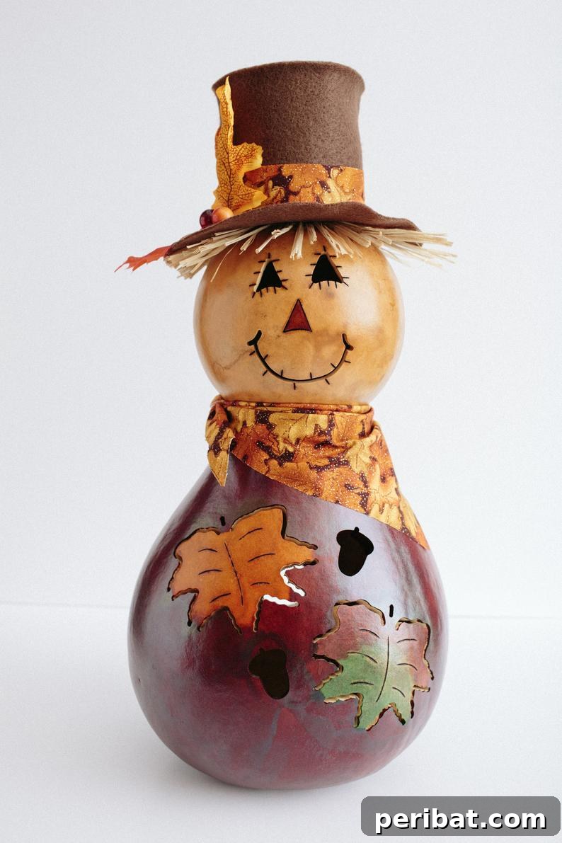 Whimsical Scarecrow Creations for Festive Autumn Decor 22 Exquisitely painted gourd scarecrow decoration, featuring intricate details and a unique artistic style