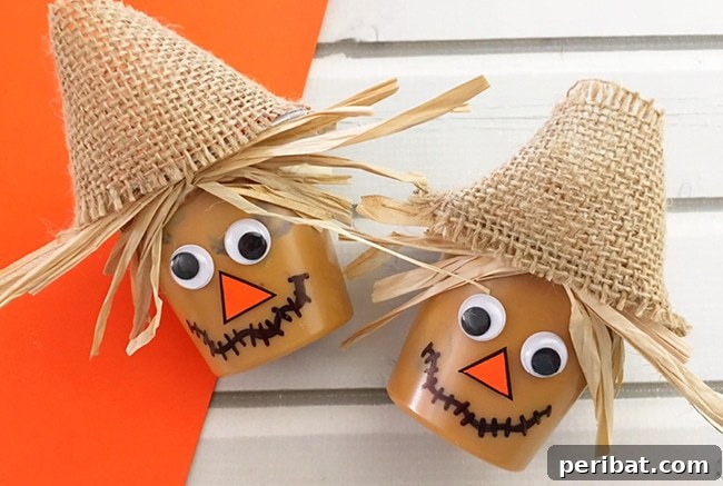 Whimsical Scarecrow Creations for Festive Autumn Decor 25 A creative scarecrow pudding cup treat, decorated with cookies and candy, suitable for fall parties