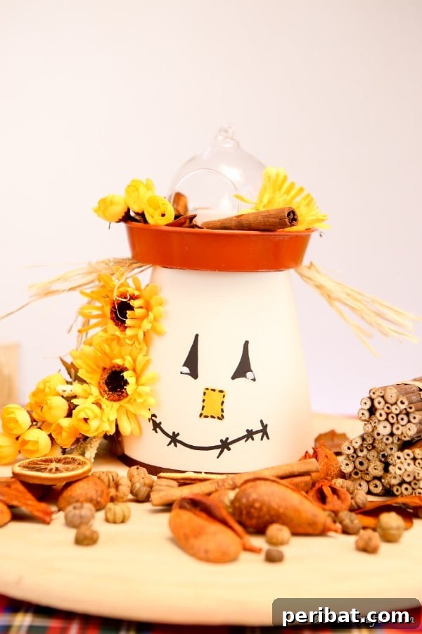 Whimsical Scarecrow Creations for Festive Autumn Decor 5 Whimsical clay pot scarecrow lantern holding a candle, perfect for a cozy autumn ambiance