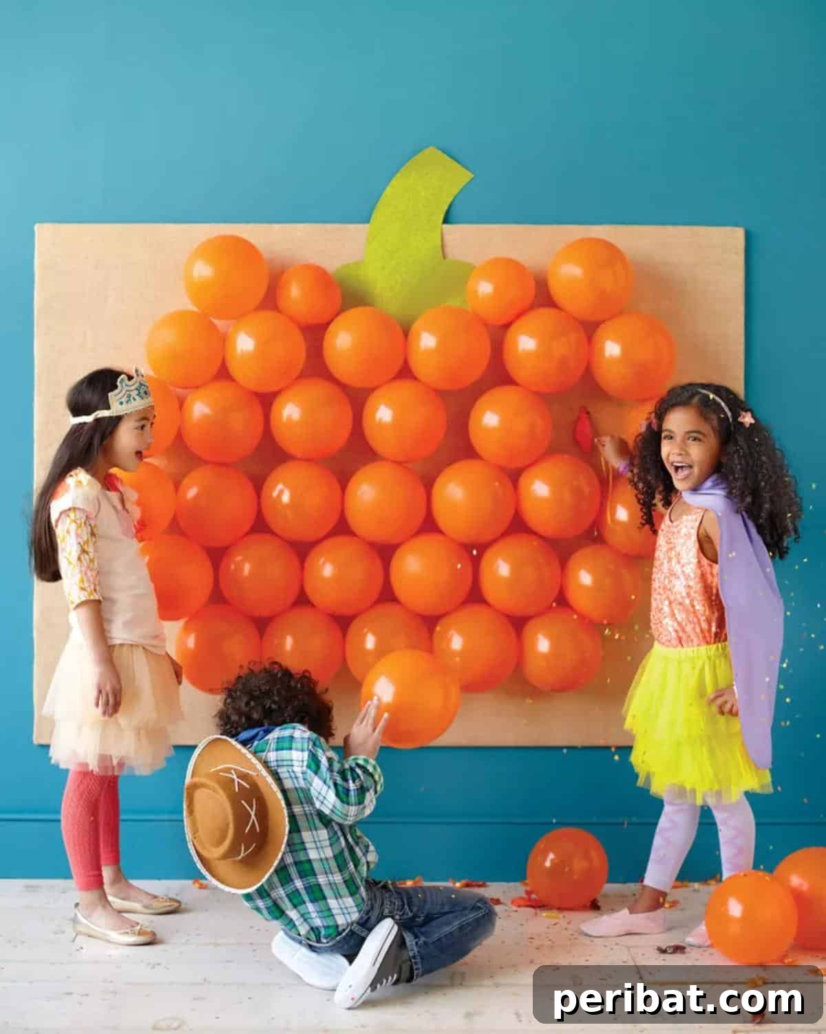 Pop Goes The Pumpkin Game - orange balloons arranged in a pumpkin shape for a popping game