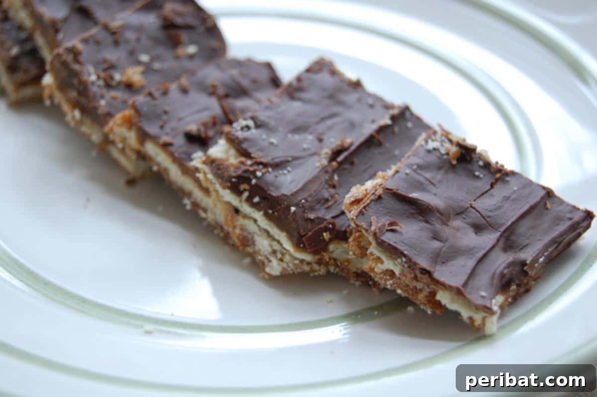 Easy homemade toffee made with saltine crackers, topped with chocolate and pecans.