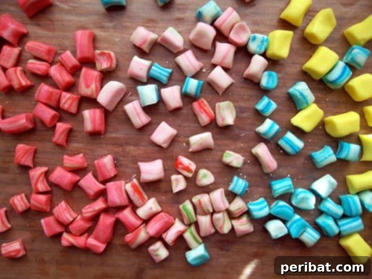 Soft homemade butter mints in various pastel colors, arranged on a serving plate.